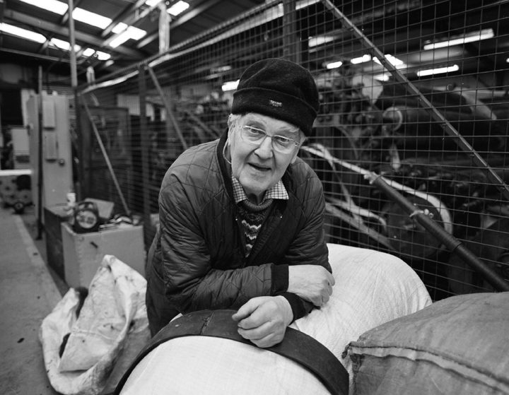 Harris Tweed mill worker at the wool bales