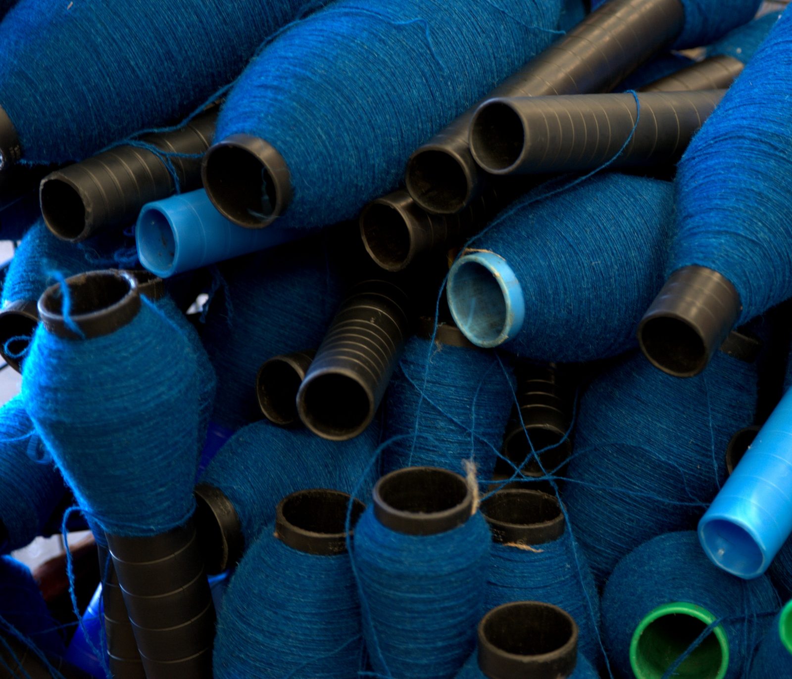 Cops of blue yarn