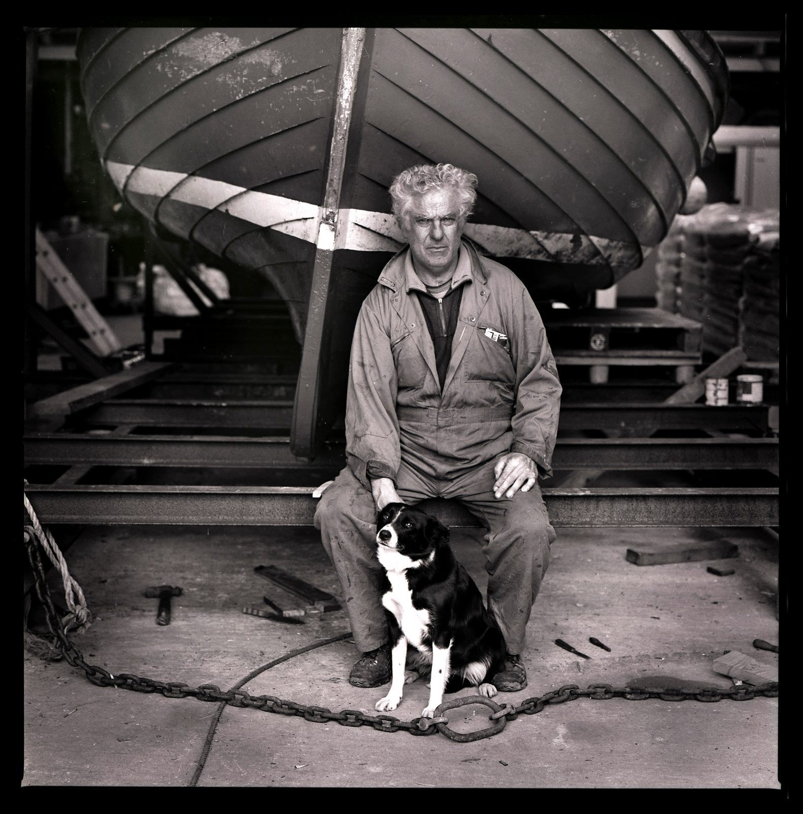 Don Brady with his boat and dog, North Uist
