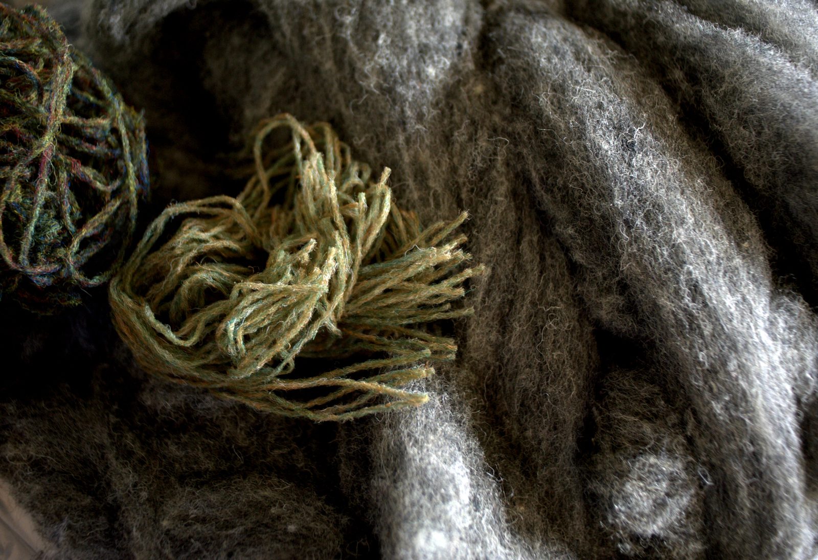 Green yarn on grey fleece