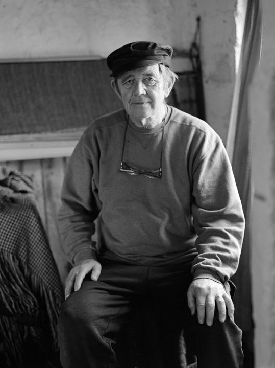 A Harris Tweed weaver, seated