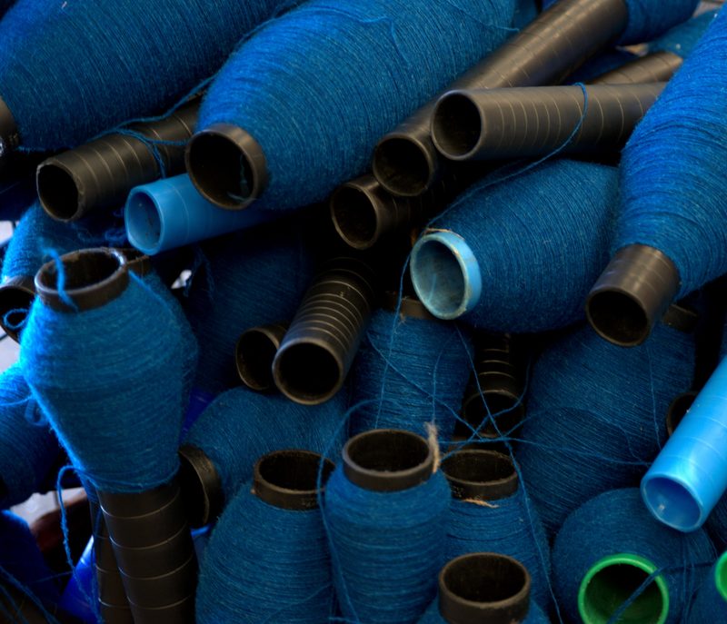 Cops of blue yarn