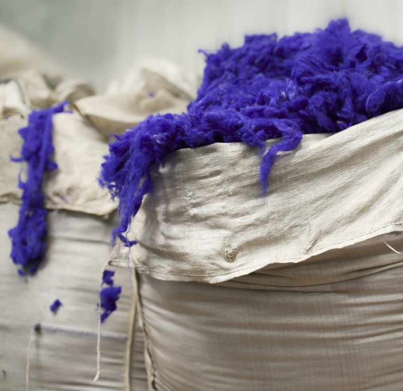 Violet wool in the bale