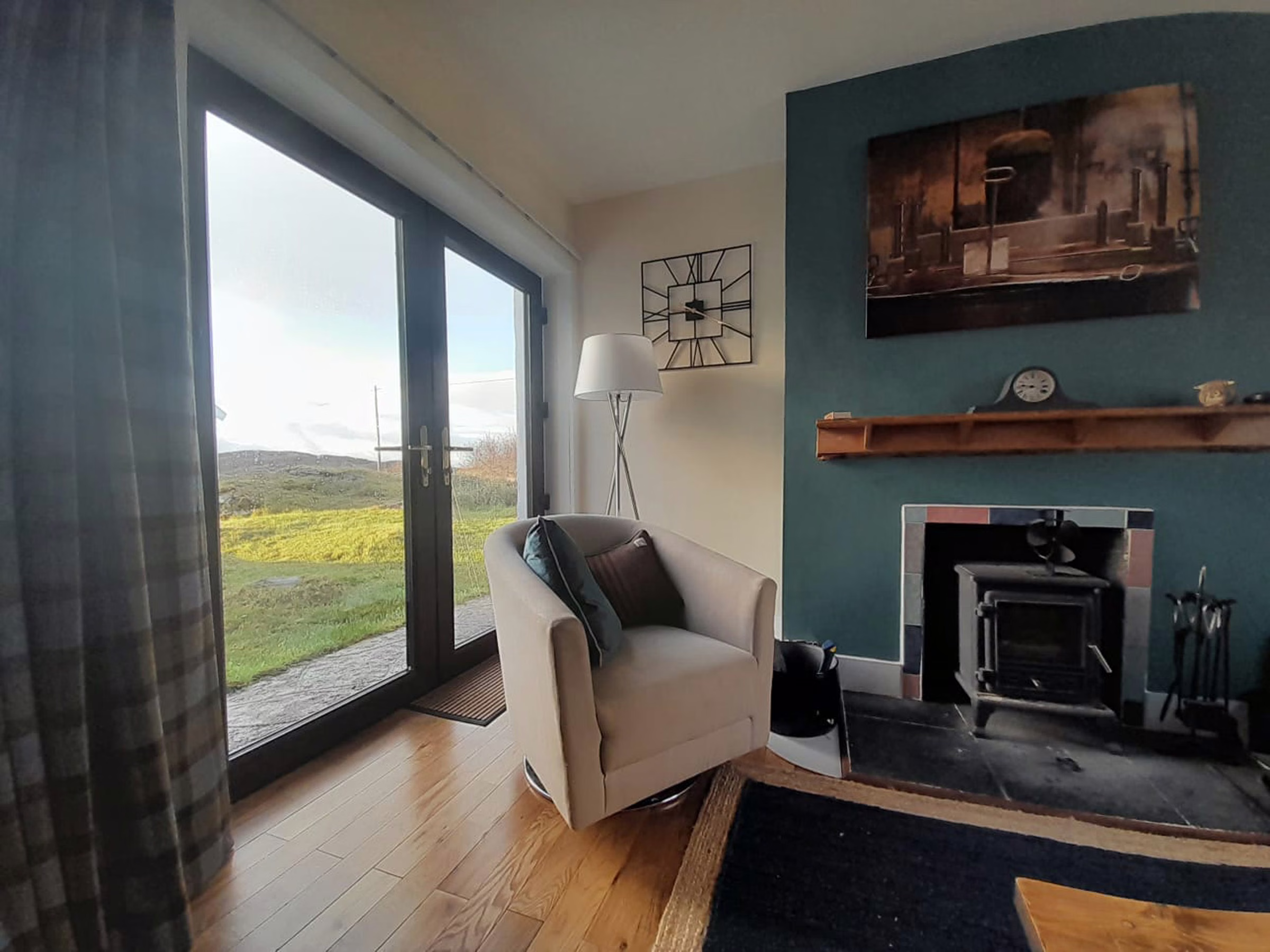 Armchair beside patio doors looking out over the moor