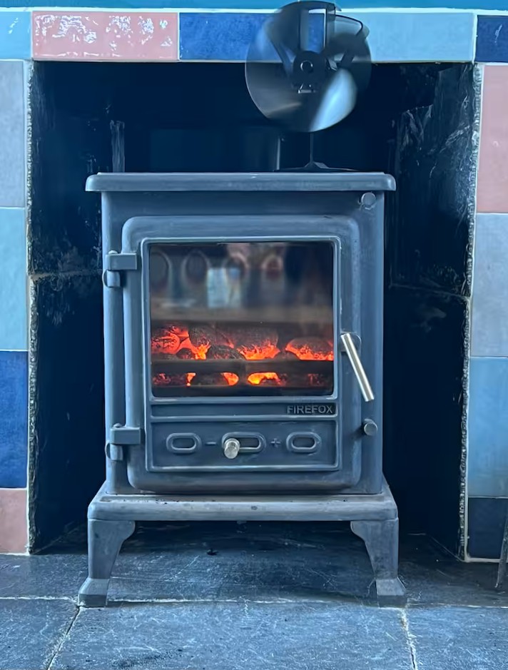 Cosy cottage interior with wood-burning stove